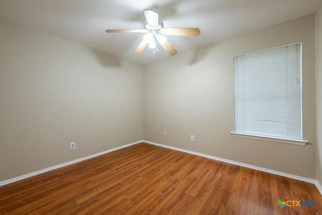 402 N Fredericksburg St Unit 9, San Marcos, TX 78666 - spare room with wood finished floors and a ceiling fan