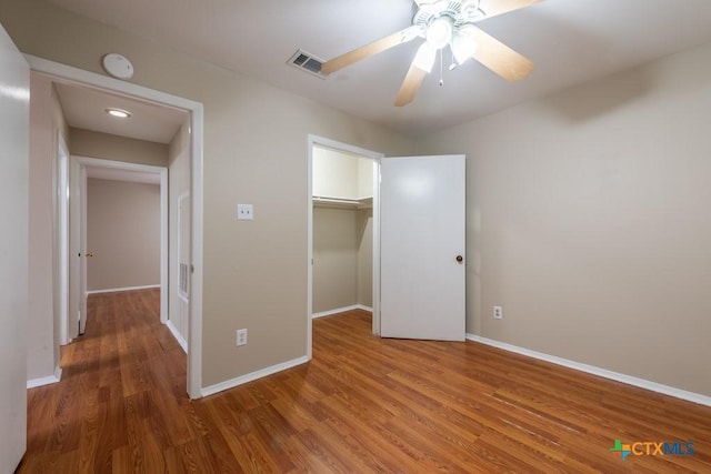 402 N Fredericksburg St Unit 9, San Marcos, TX 78666 - unfurnished bedroom featuring wood finished floors, a closet, and a ceiling fan