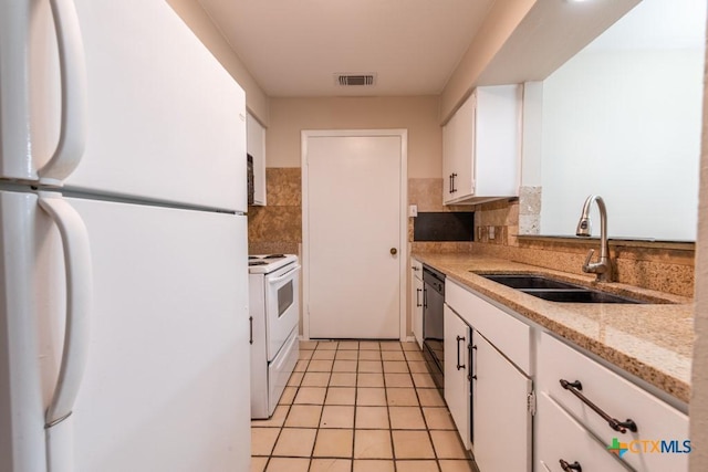 402 N Fredericksburg St Unit 9, San Marcos, TX 78666 - kitchen featuring white appliances, white cabinetry, light tile patterned flooring, decorative backsplash, and light stone counters