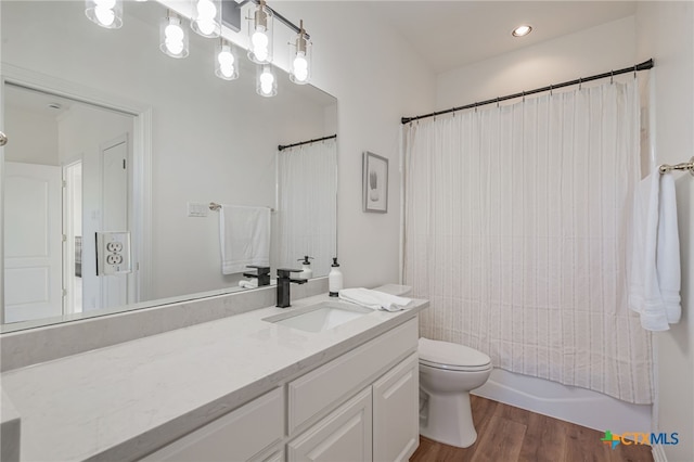 200 Tovas Secret Cv, Georgetown, TX 78628 - bathroom featuring vanity, toilet, wood finished floors, and shower / tub combo