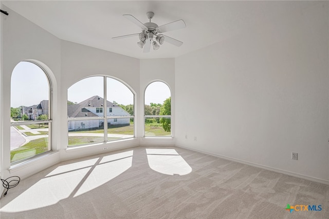 200 Tovas Secret Cv, Georgetown, TX 78628 - empty room with light colored carpet, a ceiling fan, and baseboards