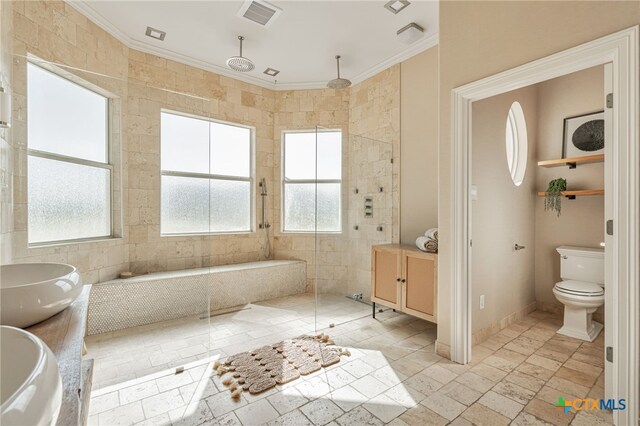 200 Tovas Secret Cv, Georgetown, TX 78628 - bathroom with crown molding, a bath, toilet, a tile shower, and vanity