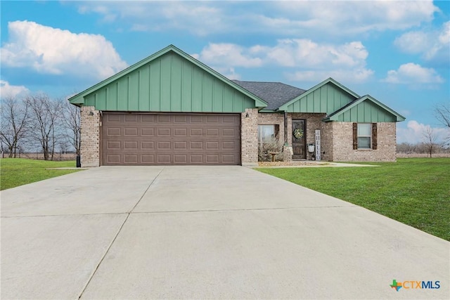 view of front of home featuring a garage, a front lawn, board and batten siding, and brick siding