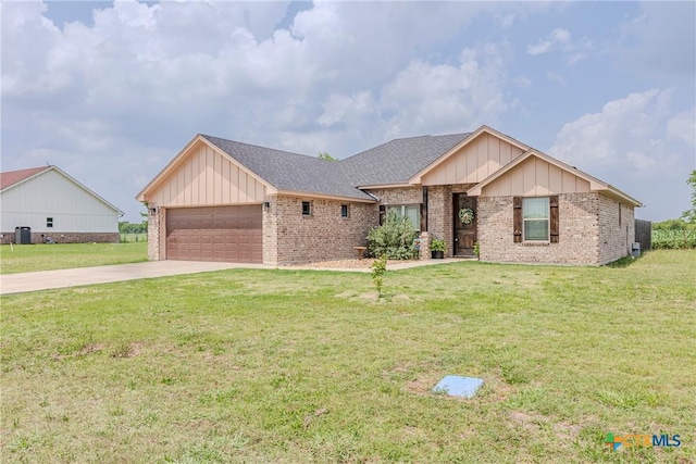 7112 Kc Ranch Ct, Temple, TX 76501 - single story home with board and batten siding, an attached garage, driveway, and brick siding