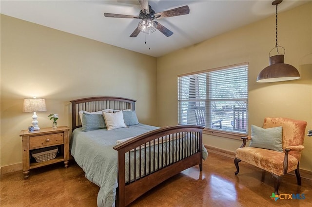 bedroom featuring ceiling fan, baseboards, and finished concrete floors