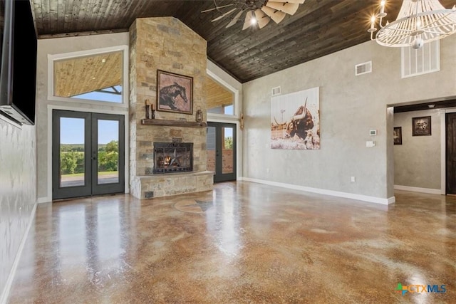 343 Riverside Dr, Killeen, TX 76542 - unfurnished living room featuring high vaulted ceiling, finished concrete flooring, french doors, baseboards, and a chandelier