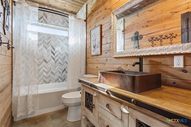 343 Riverside Dr, Killeen, TX 76542 - bathroom with wood walls, vanity, toilet, shower / bath combo, and finished concrete flooring