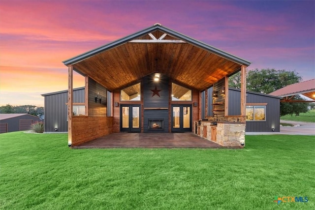 343 Riverside Dr, Killeen, TX 76542 - patio terrace at dusk featuring french doors and a lawn