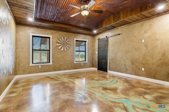 343 Riverside Dr, Killeen, TX 76542 - empty room with finished concrete flooring, a barn door, wooden ceiling, ceiling fan, and baseboards