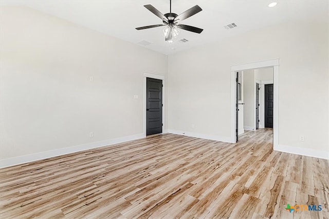 spare room with ceiling fan and light hardwood / wood-style floors