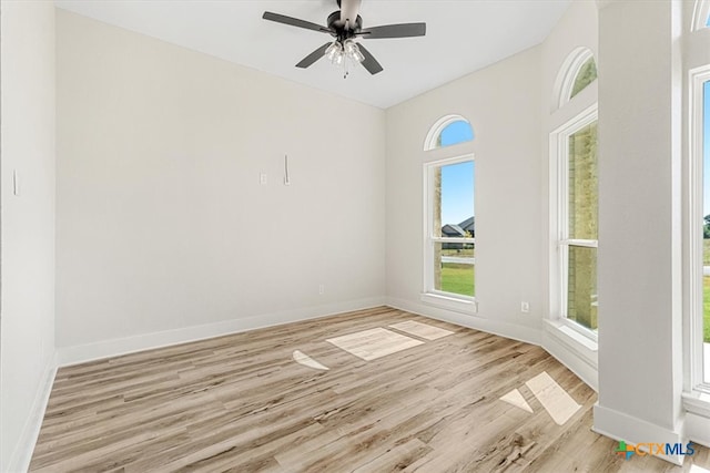 empty room featuring ceiling fan and light wood-type flooring