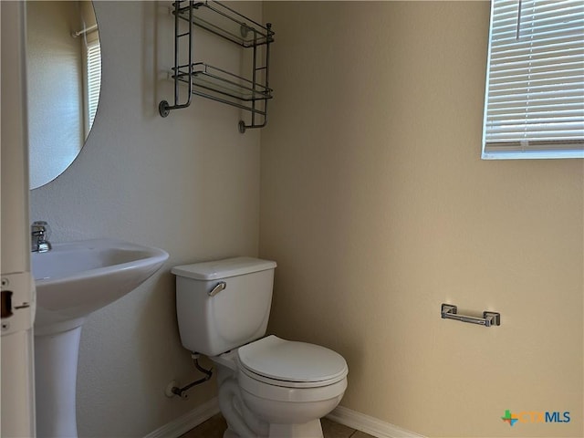 bathroom with sink and toilet