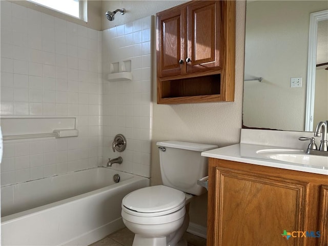 full bathroom featuring vanity, toilet, and tiled shower / bath