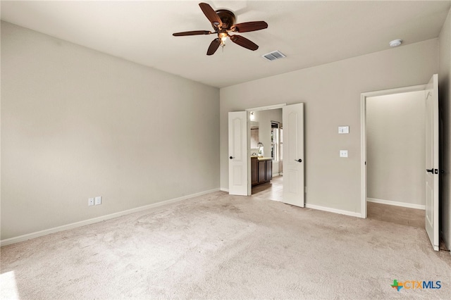 668 Peacock Ln, New Braunfels, TX 78310 - unfurnished bedroom with light colored carpet, visible vents, and baseboards