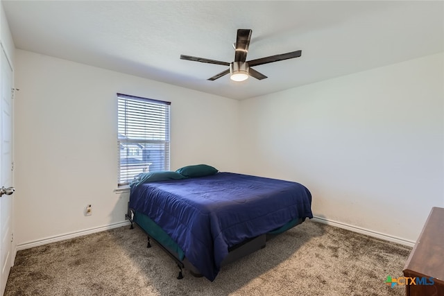 bedroom with ceiling fan and carpet floors