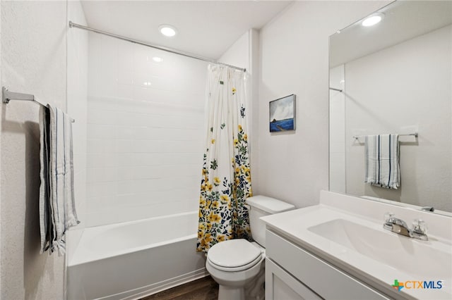 1004 Norway Dr, Seguin, TX 78155 - bathroom featuring vanity, shower / bath combo with shower curtain, recessed lighting, and wood finished floors