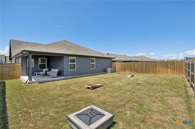 1004 Norway Dr, Seguin, TX 78155 - back of property featuring a fenced backyard, an outdoor living space with a fire pit, and a patio area