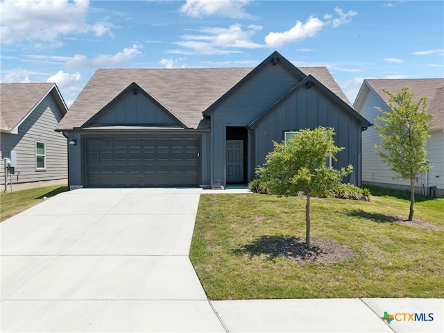1004 Norway Dr, Seguin, TX 78155 - view of front of house with board and batten siding, an attached garage, concrete driveway, a front lawn, and a shingled roof