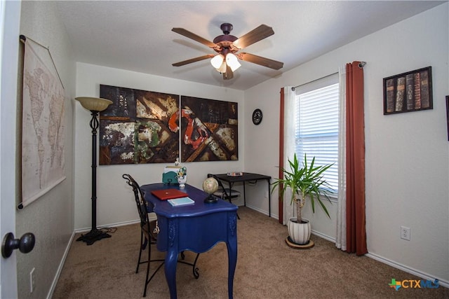 office featuring baseboards, carpet floors, and ceiling fan