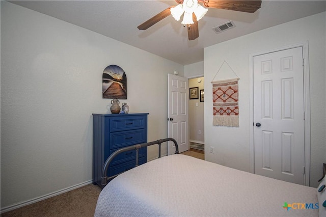 bedroom featuring visible vents, carpet flooring, a ceiling fan, and baseboards