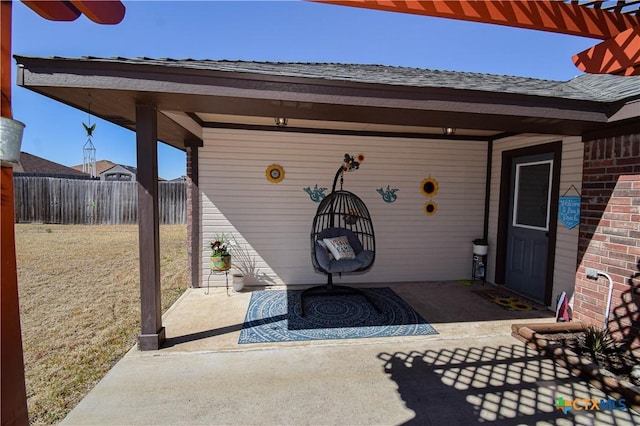 view of patio featuring fence