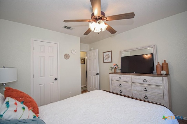 bedroom featuring visible vents and ceiling fan