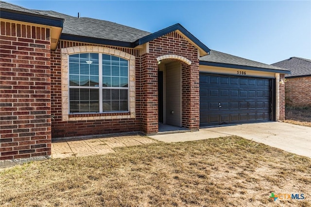 ranch-style house featuring a garage