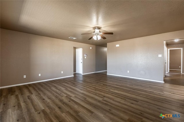 unfurnished room with a textured ceiling, dark hardwood / wood-style flooring, and ceiling fan