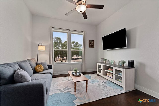 living room featuring wood-type flooring and ceiling fan