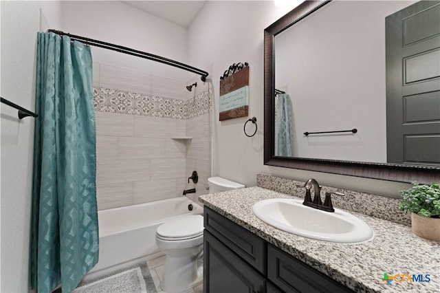 full bathroom with shower / tub combo with curtain, vanity, and toilet