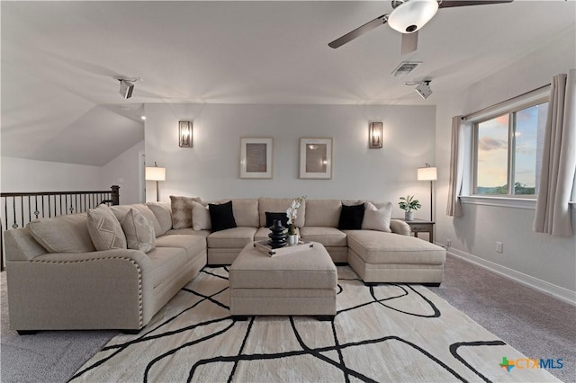 carpeted living room with vaulted ceiling and ceiling fan