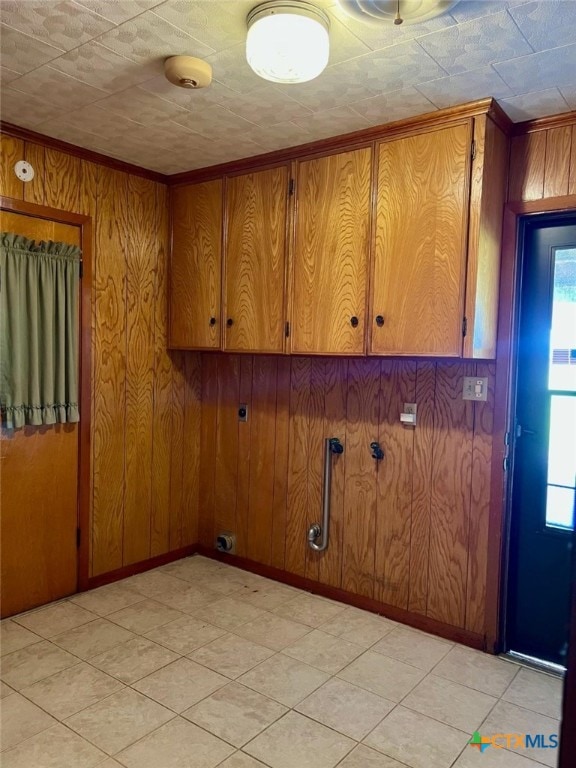 6414 Fm 234 N, Edna, TX 77957 - laundry area with plenty of natural light, wood walls, ornamental molding, and baseboards
