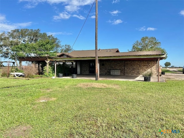 6414 Fm 234 N, Edna, TX 77957 - back of property with a yard and brick siding
