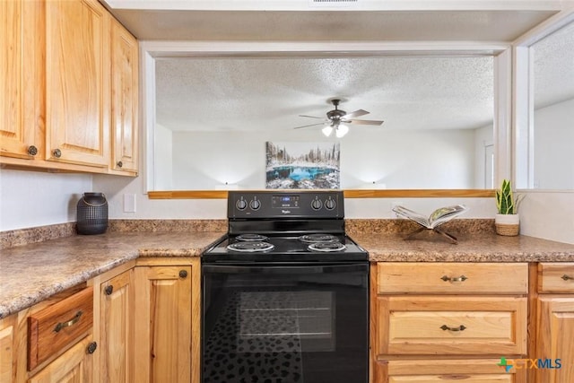 kitchen featuring black / electric stove, visible vents, ceiling fan, light brown cabinetry, and a textured ceiling