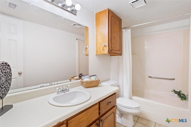bathroom with tile patterned flooring, toilet, and visible vents