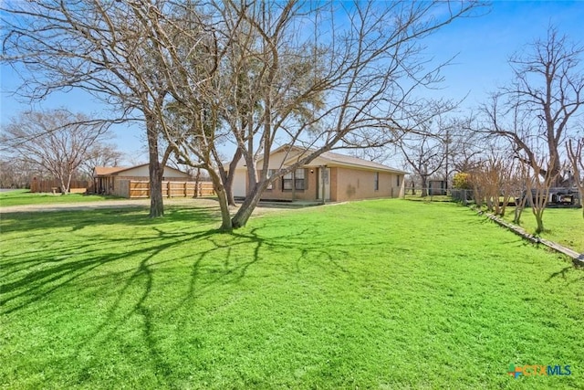 view of yard with fence