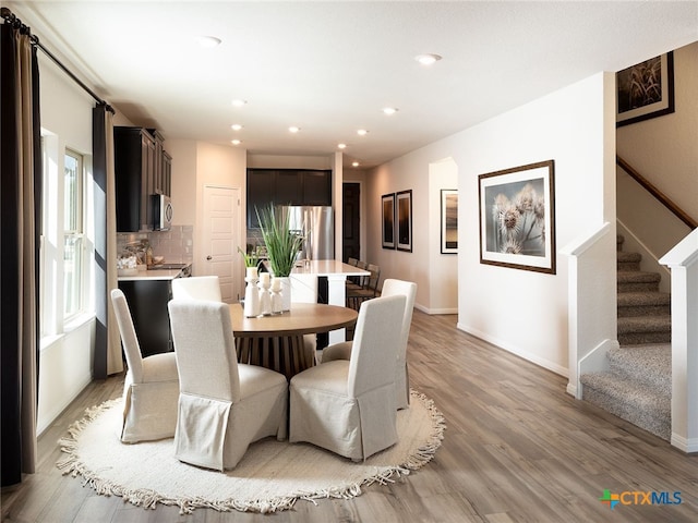 dining space featuring hardwood / wood-style floors