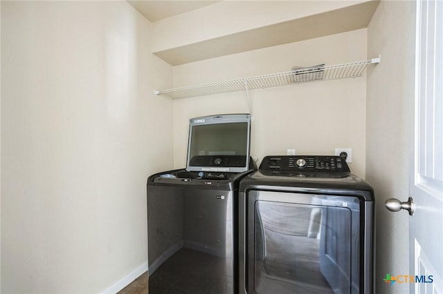 laundry area with washer and clothes dryer