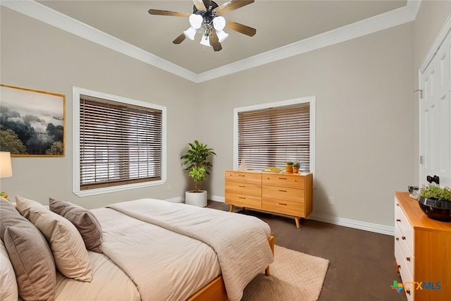 bedroom with crown molding, ceiling fan, and dark hardwood / wood-style floors