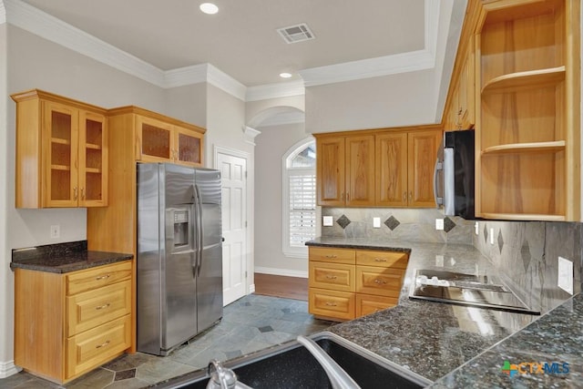 kitchen with stainless steel appliances, crown molding, and backsplash