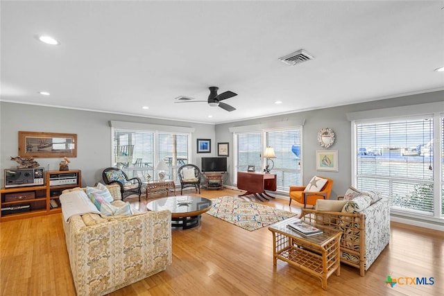 100 Bayshore Drive, Ingleside On The Bay, TX 78362 - living area with crown molding, light wood finished floors, recessed lighting, and a ceiling fan