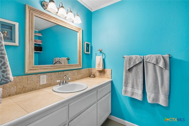 bathroom featuring vanity, crown molding, and backsplash