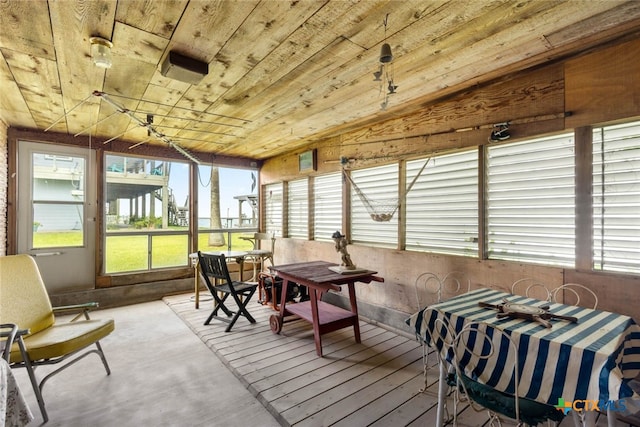 sunroom with wood ceiling and vaulted ceiling