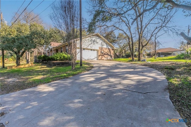 view of side of home featuring a garage