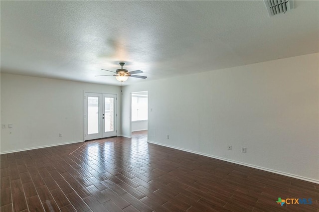 spare room with french doors, a textured ceiling, and ceiling fan