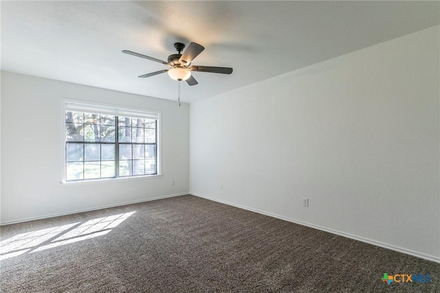 empty room featuring carpet and ceiling fan