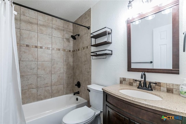 full bathroom with vanity, toilet, shower / bathtub combination with curtain, and a textured ceiling