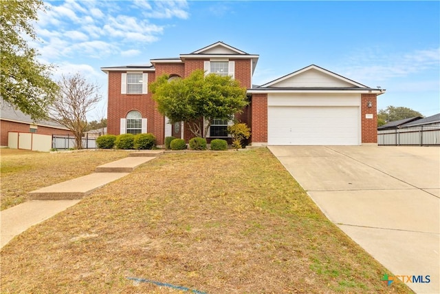 view of front of property with a garage and a front yard