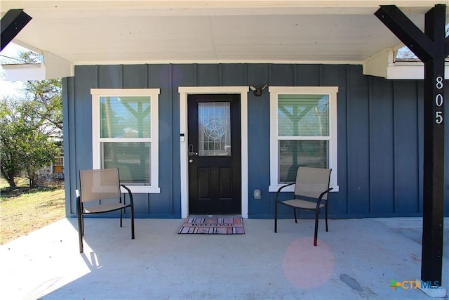 property entrance with board and batten siding