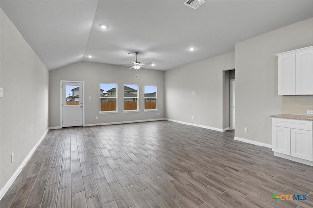 unfurnished living room with lofted ceiling and ceiling fan